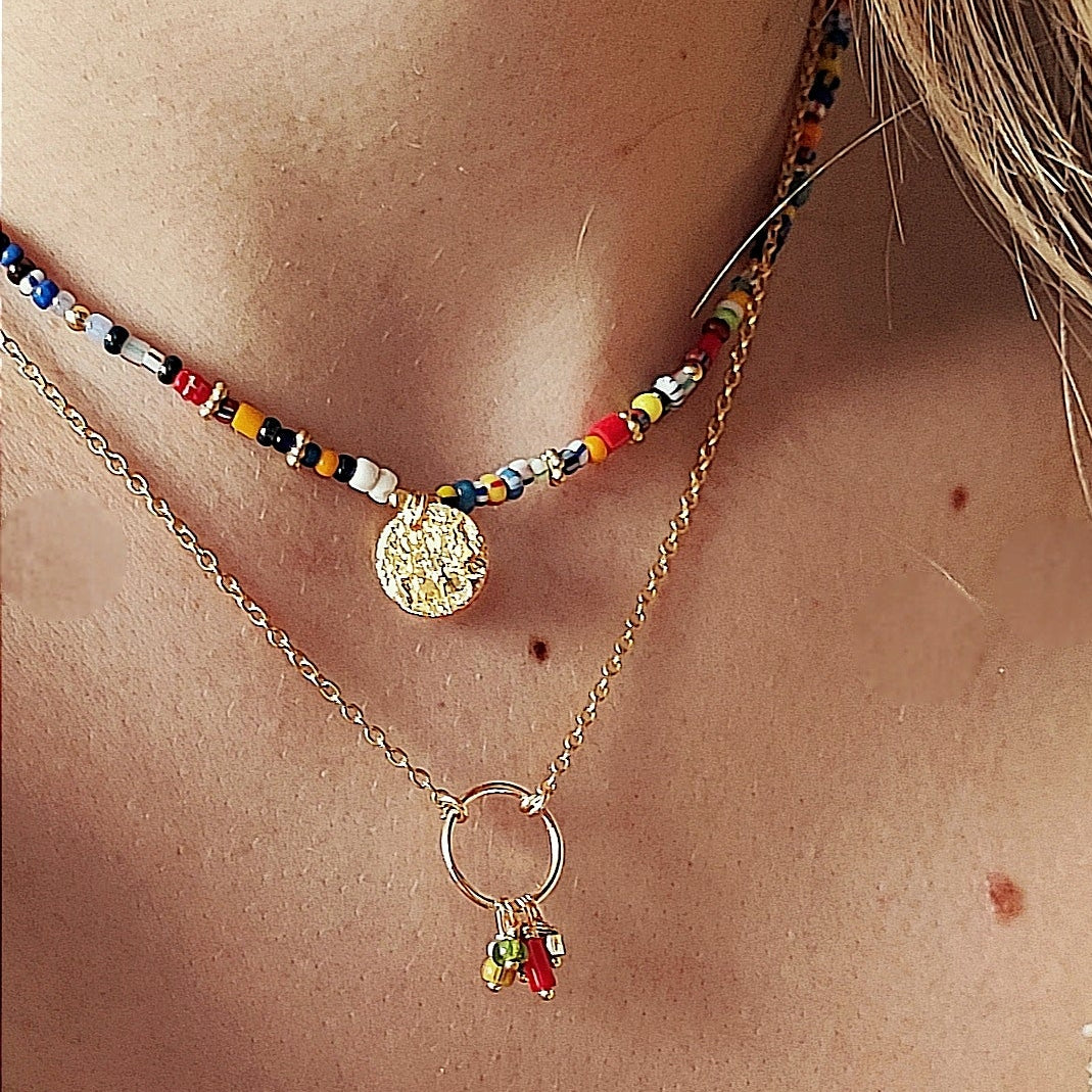 Ô PLUM LOMÉ collier médaille plaqué or perles Afrique